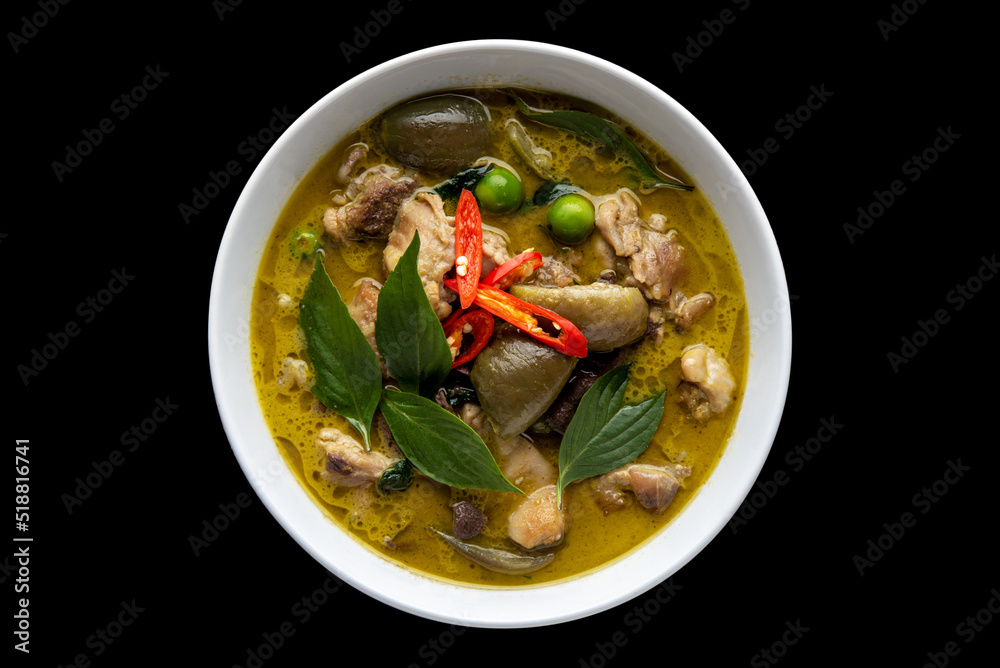Thai food chicken green curry on black isolated background. top view Thai food chicken green curry on black isolated background. top view