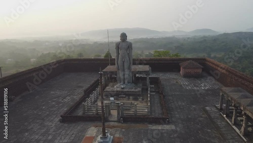 Gomateshwara Statue built in the 15th century. Jain statue stands 40 ft. tall. Karkala, Karnataka, India. (aerial photography) photo