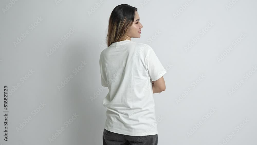 Close up view of a woman that giving her charming smile while looking toward her side