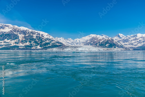 A close view of the end of the Valerie Glacier from Disenchartment Bay, Alaska in summertime