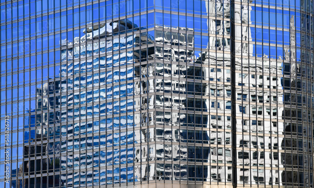Big city urban skyline reflections in the glass windows