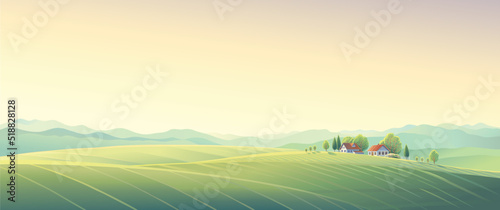 Summer rural landscape with hills and fields and village, on top of a hill.