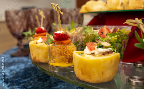 snacks and salads on the buffet table. catering at the event.