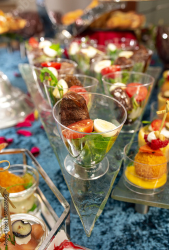 snacks and salads on the buffet table. catering at the event.