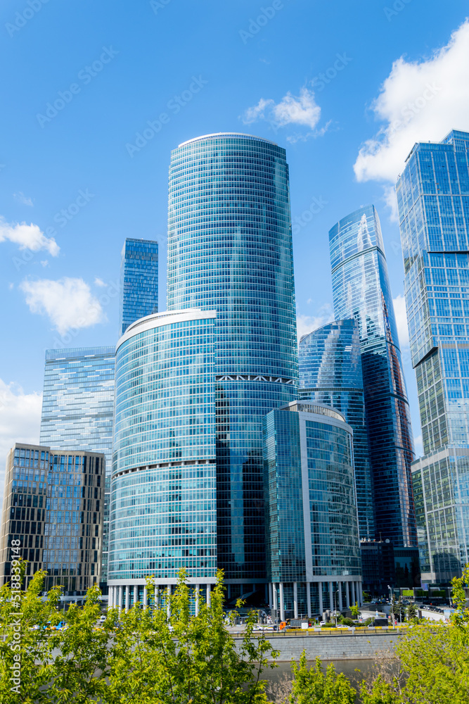 Moscow-City and Moscow-river area, Russia. modern architecture. Moscow City and skyscraper Moscow International Business Center in daytime against the blue sky with place for text Moscow-City and Moscow-river area, Russia. modern architecture. Moscow City and skyscraper Moscow International Business Center in daytime against the blue sky with place for text