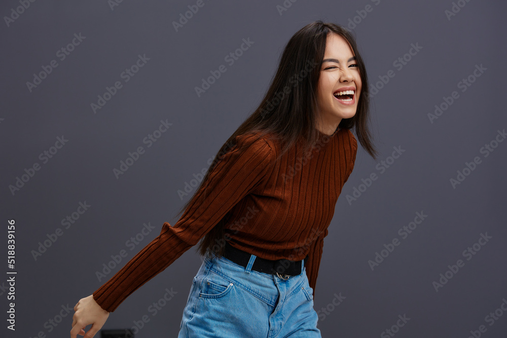Brunette hand gestures brown sweater fashion emotions isolated background Brunette hand gestures brown sweater fashion emotions isolated background