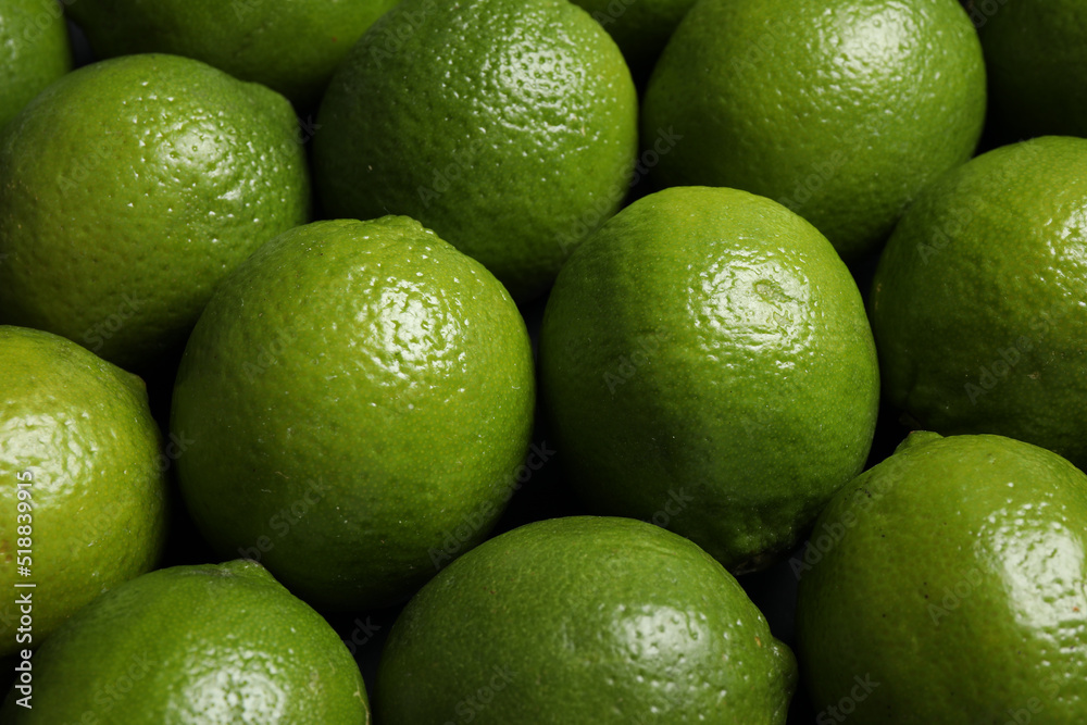 Fresh ripe green limes as background, closeup Fresh ripe green limes as background, closeup