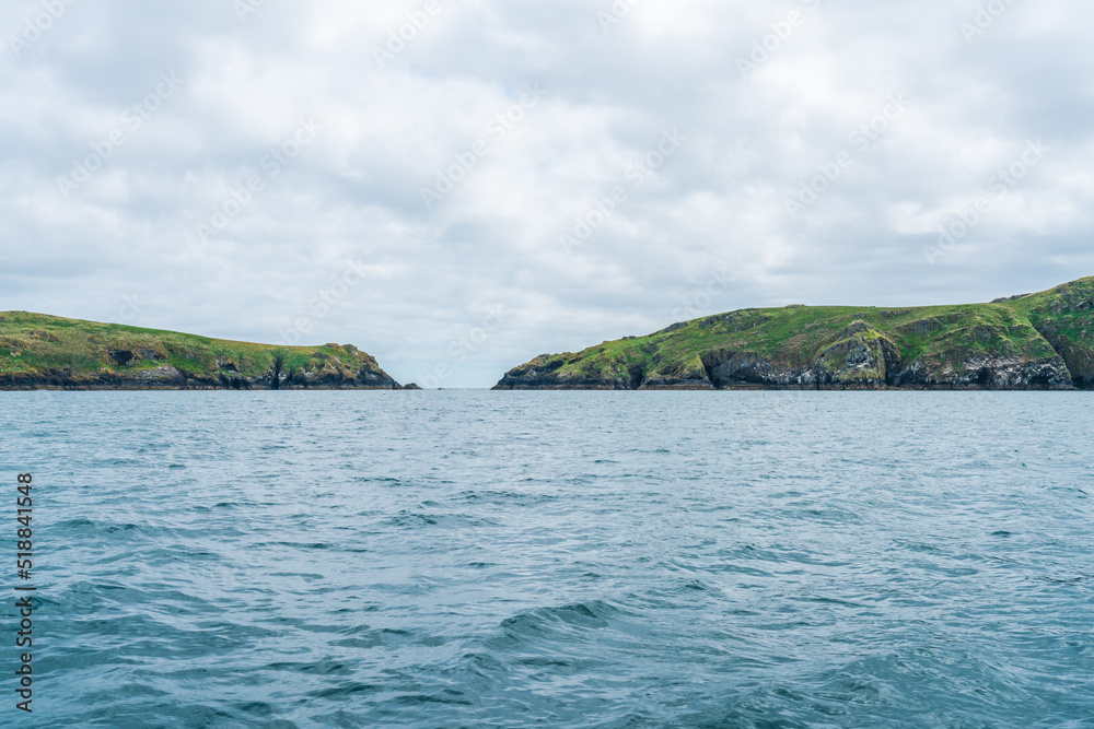 View of Skomer Island from a boat, Wales, UK