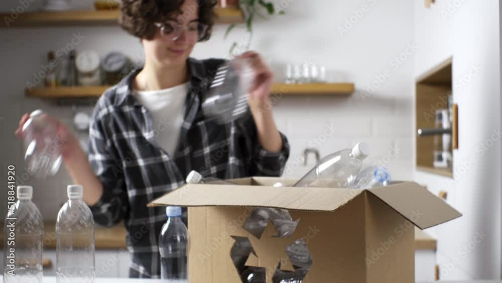 Concept of recycling, waste sorting. Girl manually sorts, throws plastic bottles in trash can. Bottle basket in kitchen. Sorting of plastic waste. Woman at kitchen table recycles plastic bottles
Concept of recycling, waste sorting. Girl manually sorts, throws plastic bottles in trash can. Bottle basket in kitchen. Sorting of plastic waste. Woman at kitchen table recycles plastic bottles