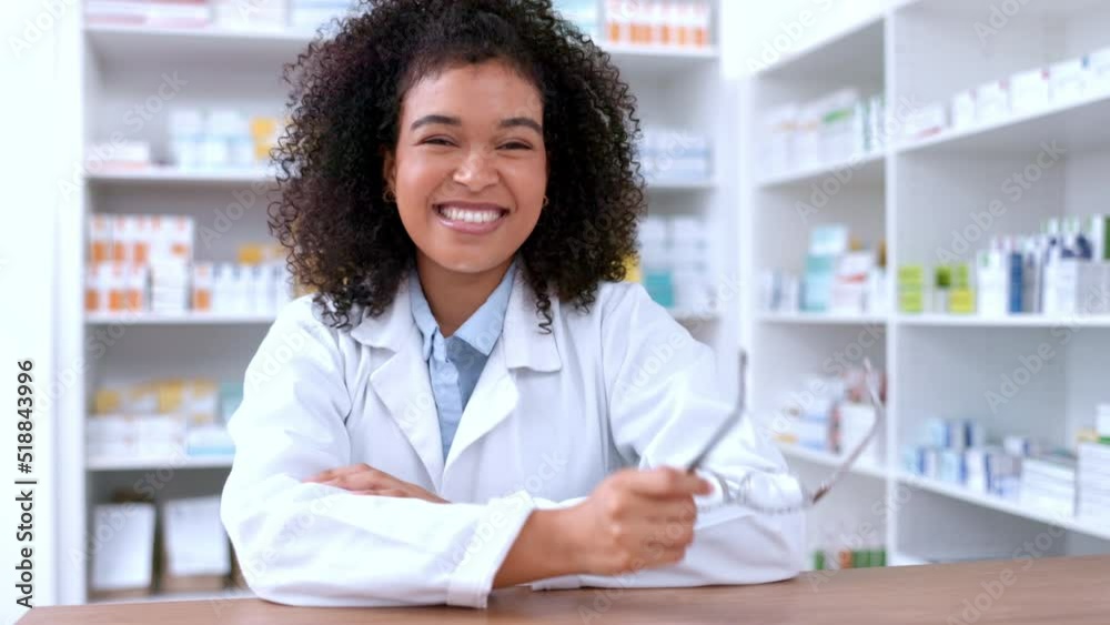 Portrait of a young pharmacist removing glasses and looking confident with her new lenses. Happy African chemist or pharmaceutical worker standing behind pharmacy prescription medicine counter Portrait of a young pharmacist removing glasses and looking confident with her new lenses. Happy African chemist or pharmaceutical worker standing behind pharmacy prescription medicine counter