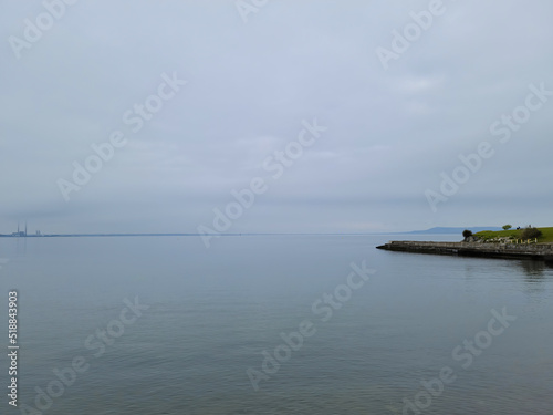 The front view in the morning sky is bright blue with clear white clouds. And the ocean deep indigo in daylight. Feeling calm, cool, relaxing. The idea for cold background and copy space on the top.