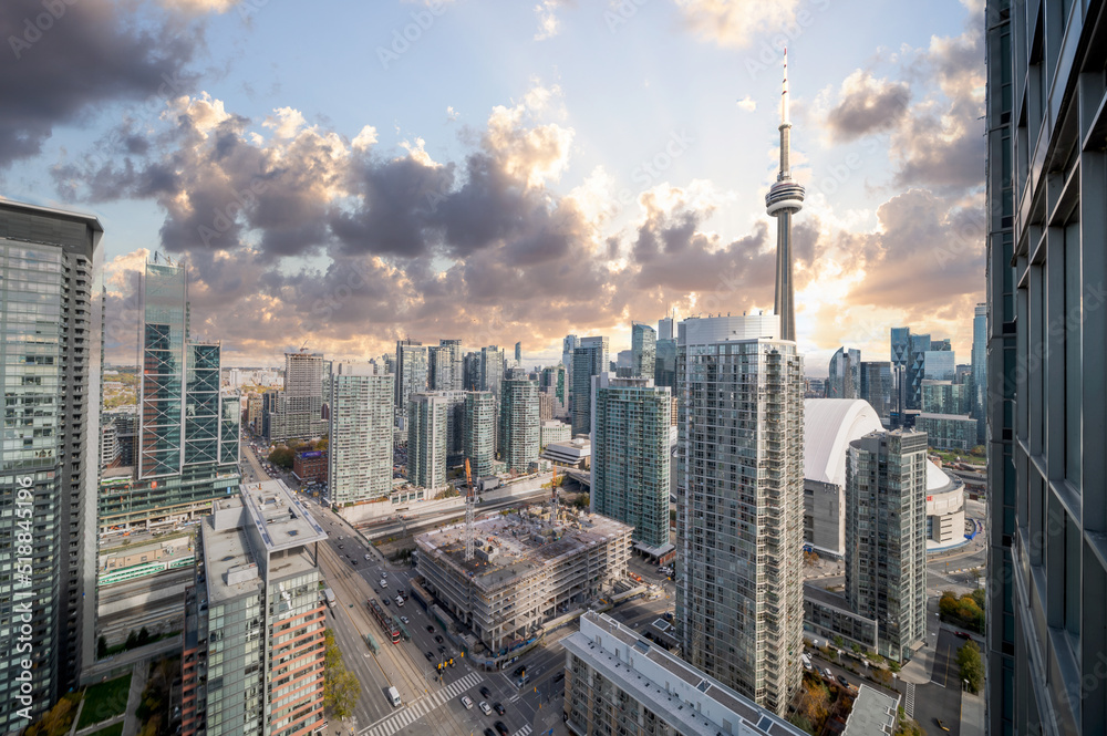blue skies  and cloudsToronto skyline cn tower and condos and Buisness buildings and streets drone view 