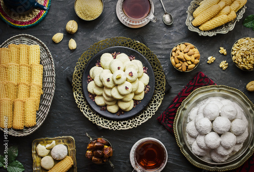 Cookies for celebration of El-Fitr Islamic Feast(The Feast that comes after Ramadan). Varieties of Eid Al-Fitr sweets (Kahk-Gorayeba-Biscuits). Served with roasted nuts and cup of tea.