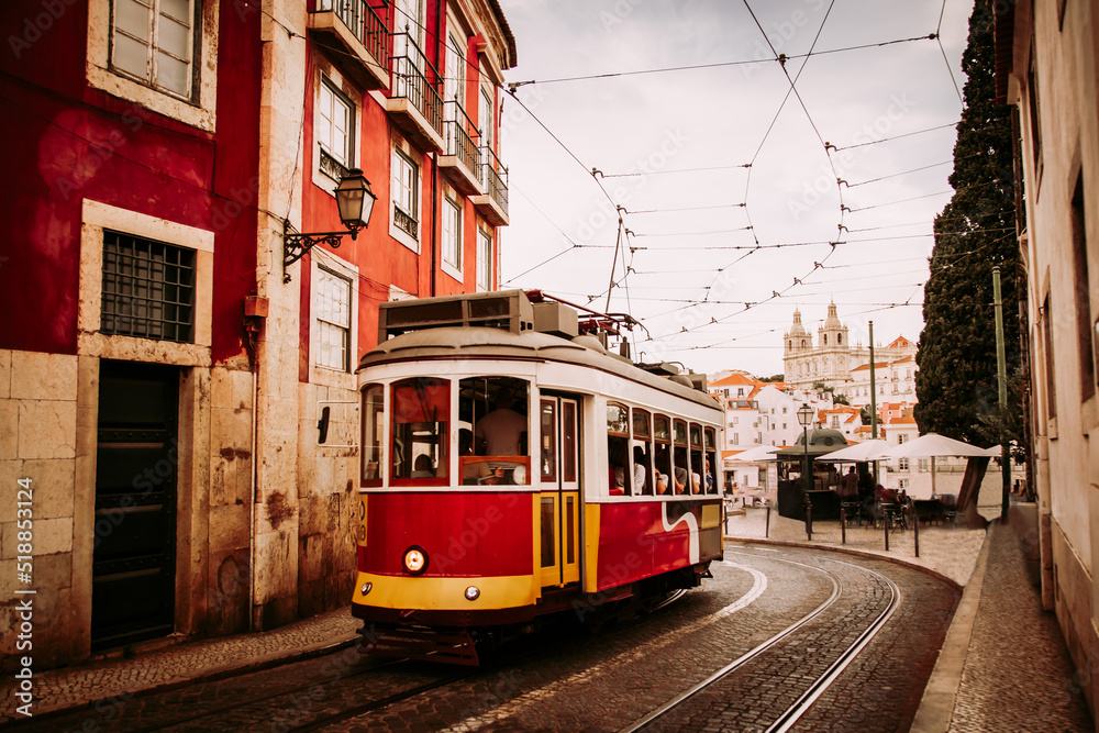 Vintage tram in Alfama historical district of Lisbon, Portugal