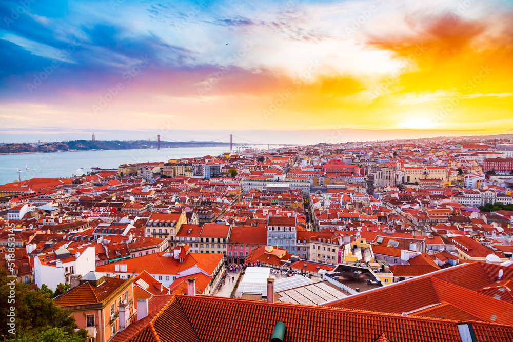 Beautiful panorama of old town and Baixa district in Lisbon city during sunset, seen from Sao Jorge Castle hill, Portugal