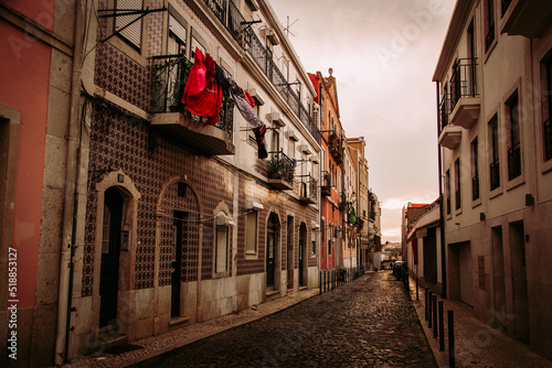 Alfama old town street in Lisbon during sunset  Portugal