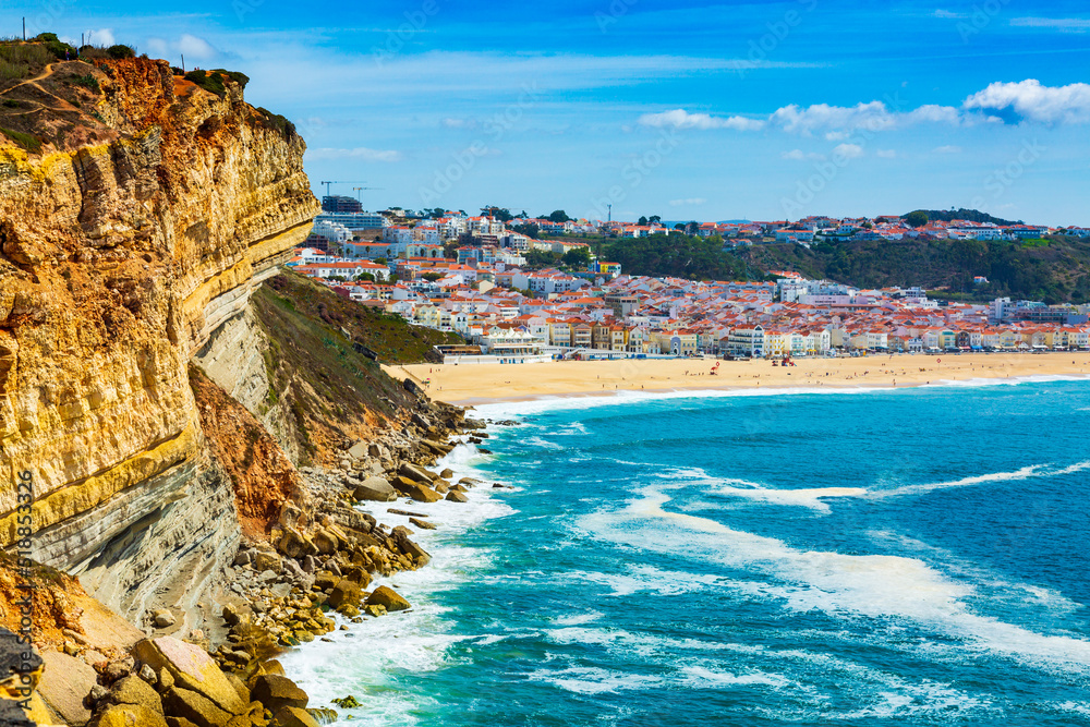 Nazare, Portugal: High Cliff over Atlantic Ocean with Nazare town in the background, Portugal