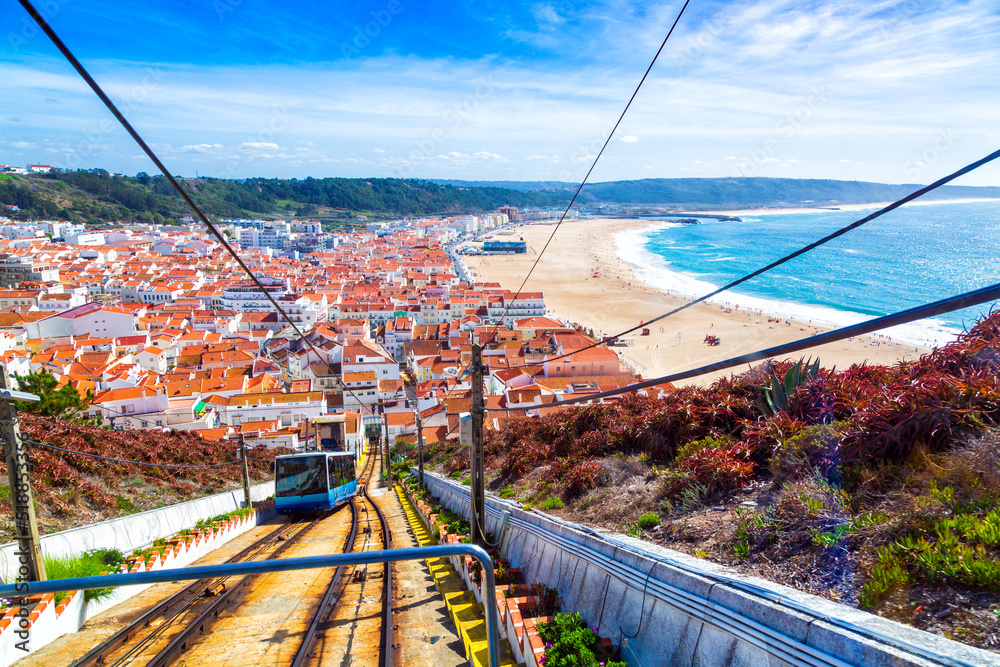 Nazare Funicular line seen from the Sitio district with panorama of Nazare village and Atlantic Ocean, Portugal