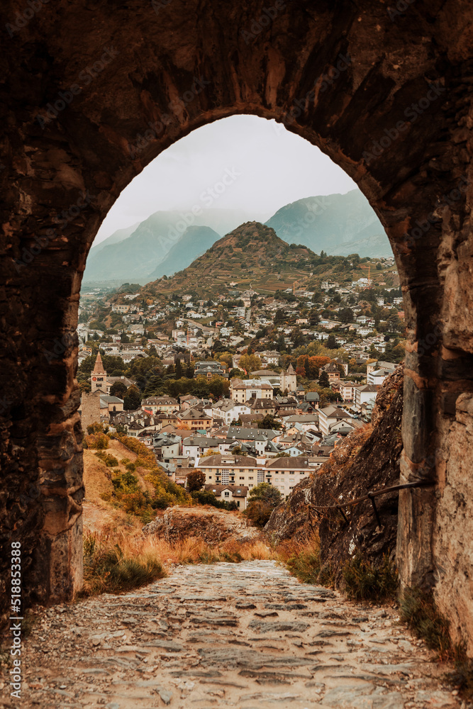 Fototapeta premium Sion, Switzerland: Entrance gate of Tourbillon Castle with city view in canton Valais