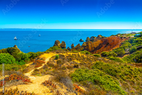 Beautiful sandy ciffs along Algarve ocean coast neer Lagos city, Portugal photo