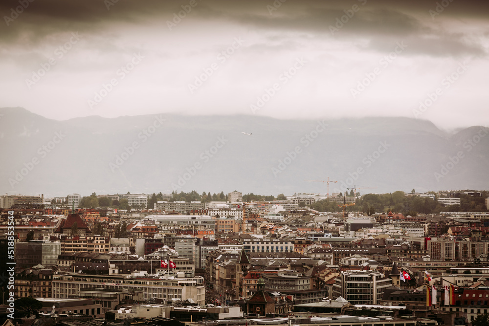 Geneva, Switzerland: city and mountain view in cloudy day seen from St. Peter's Cathedral tower