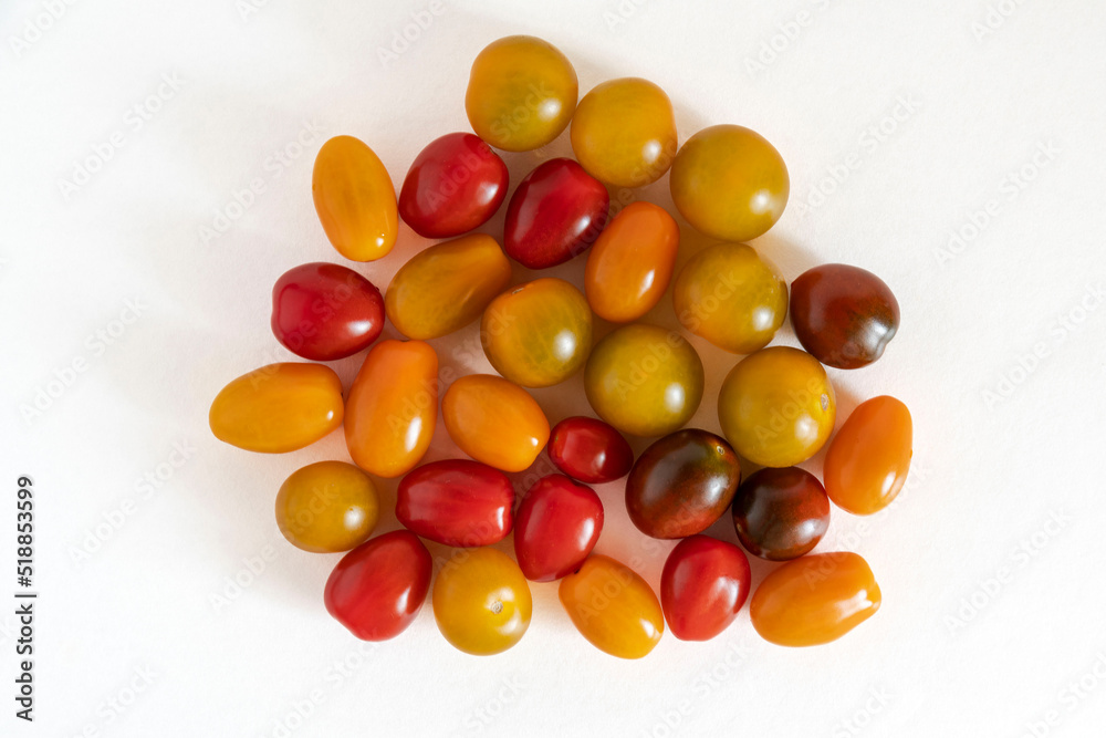 Close-up of a group of cherry tomatoes of different colours, yellow, green, black and red Close-up of a group of cherry tomatoes of different colours, yellow, green, black and red