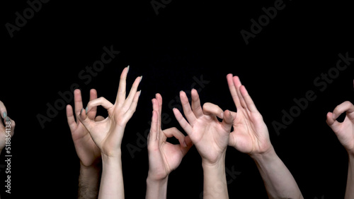 Hands making Okay or flicking sign. Okay coding by hand isolated on black background. Hands show gesture ok or everything is good isolated on black background