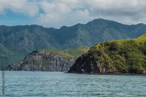 the green and rocky coast of the Murcielago Island in Costa Rica