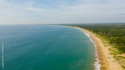 Aerial drone of Sandy beach and turquoise water. Kalkudah Beach, Sri Lanka.