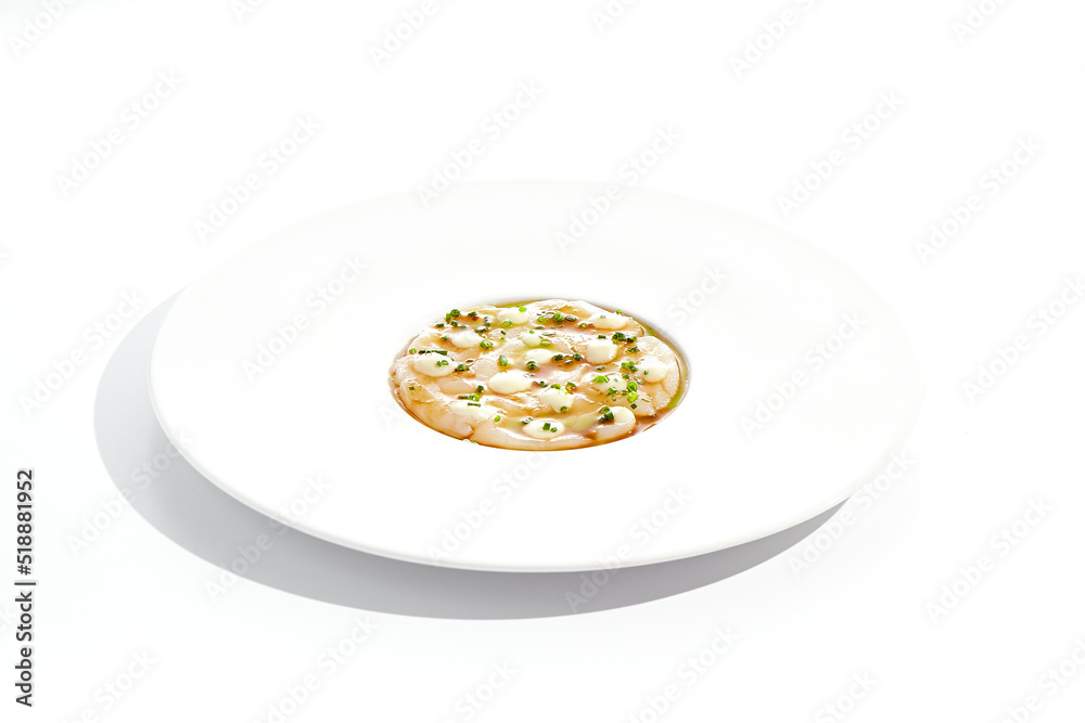 Delicious food sea scallop carpaccio in yuzu sauce on white background. Scallop ceviche in