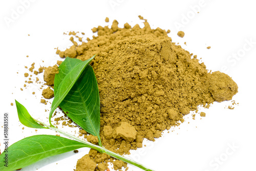 Mehendi or henna leaves and powder heap isolated on white background, Lawsonia inermis powder, Herbs for hair. photo