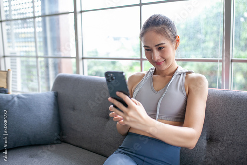 Young Asian woman using smratphone checking social media application on website online at home, feel relax and enjoy communicate and discuss in living room. Free Download Young Asian woman using smratphone checking social media application on website online at home, feel relax and enjoy communicate and discuss in living room. - GFXLoad