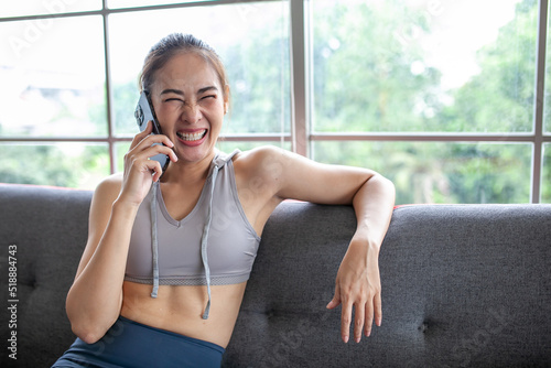 Young Asian woman using smratphone at home, feel relax and enjoy communicate and discuss in living room. Free Download Young Asian woman using smratphone at home, feel relax and enjoy communicate and discuss in living room. - GFXLoad