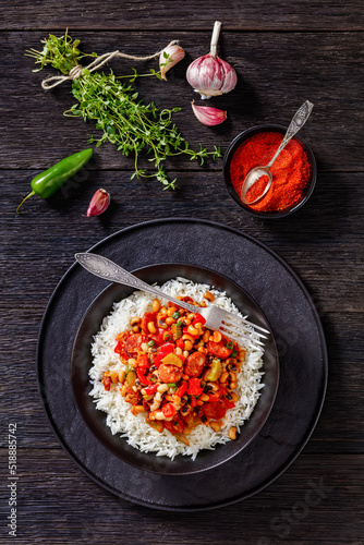 Hoppin John with rice in black bowl, top view