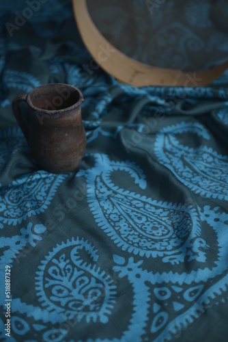 Azerbaijani national national silk scarf called Kelagayi still life with Clay pot and sieve for dough studio shooting  photo