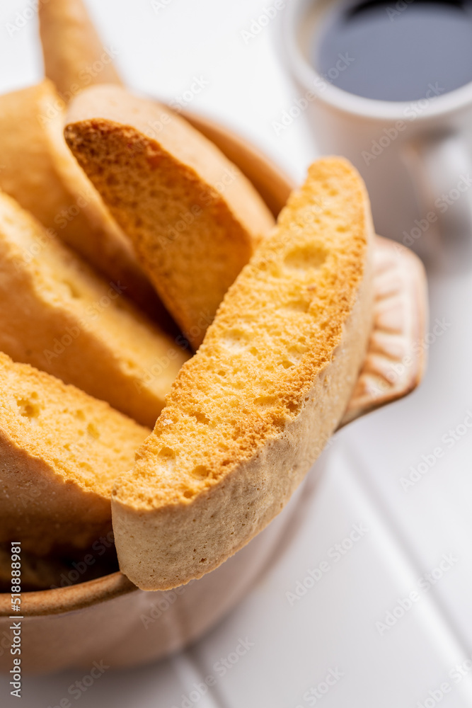 Sweet anicini cookies. Italian biscotti with anise flavor in bowl on white table. Sweet anicini cookies. Italian biscotti with anise flavor in bowl on white table.