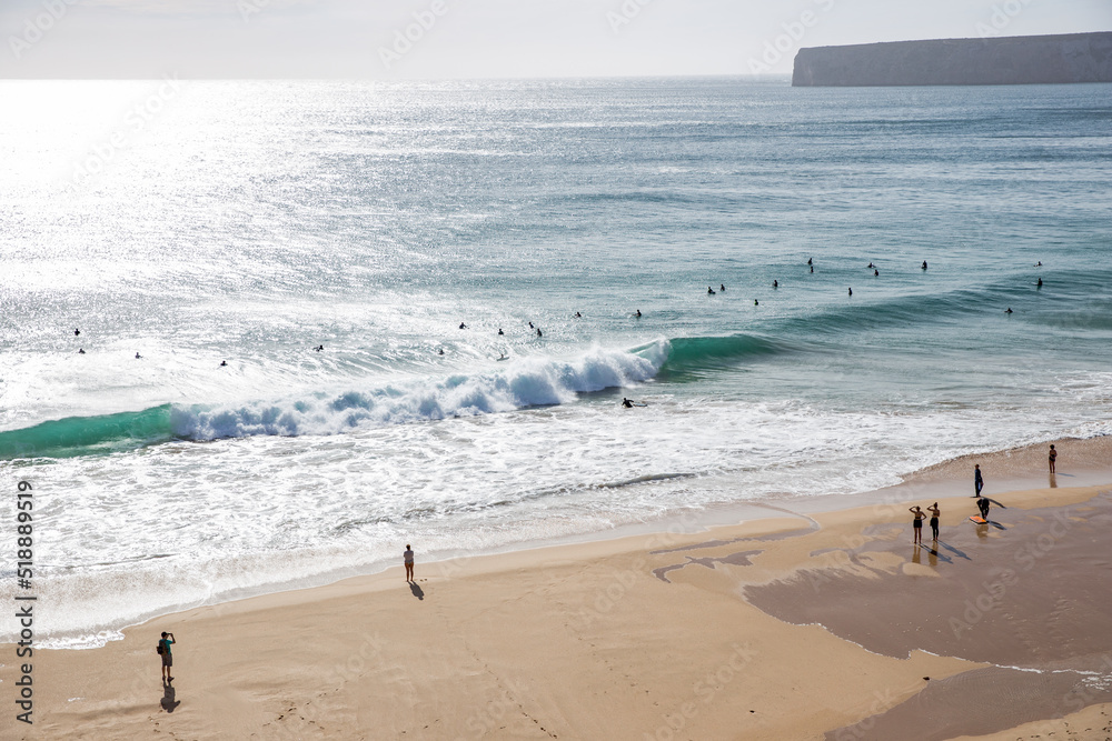 People on the beach and surfers at Atlantic Ocean, Portugal