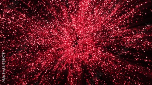 Abstract ruby red glitter explosion in slow motion Bokeh background with shining defocus blurred sparkles dust macro close up with alpha channel