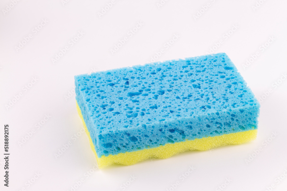 Yellow- blue sponge for washing dishes close-up Yellow- blue sponge for washing dishes close-up