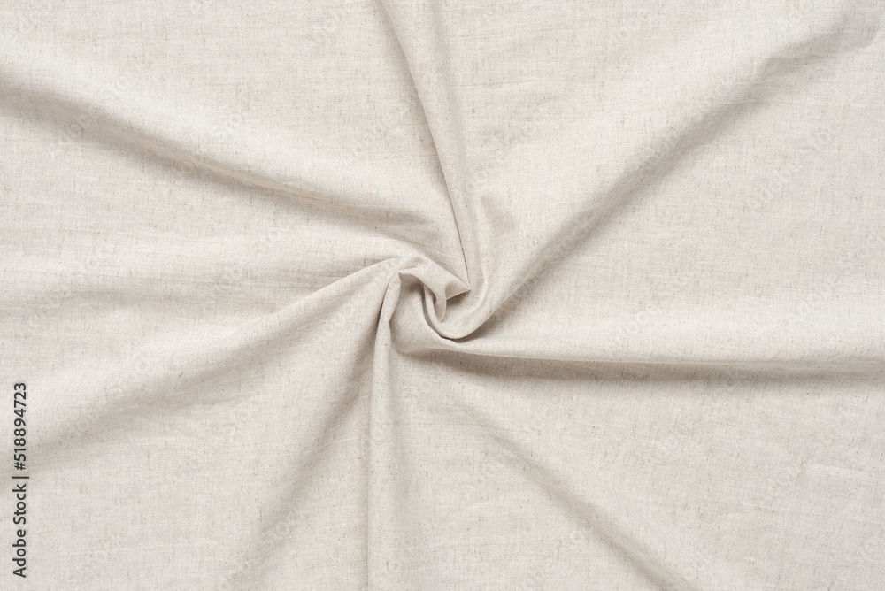Fototapeta premium Texture of beige linen fabric swirl. The concept of environmentally friendly fabrics.