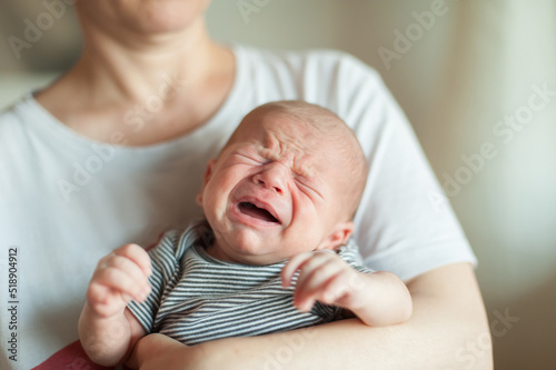 Photography Sweet and cute small little newborn baby is hungry and upset and cry strongly inviting her parents to feed her and solve her problem