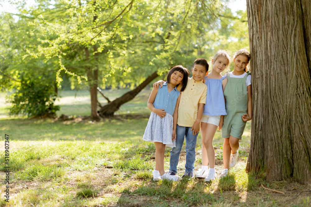 Group of asian and caucasian kids having fun in the park Group of asian and caucasian kids having fun in the park