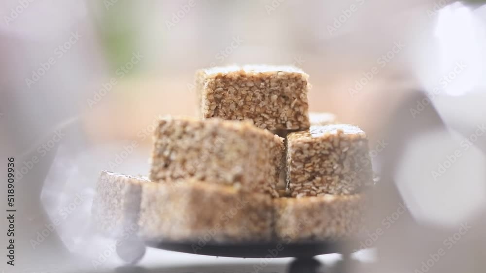 Serving of delicious sesame seeds candy.
Serving of delicious sesame seeds candy.
