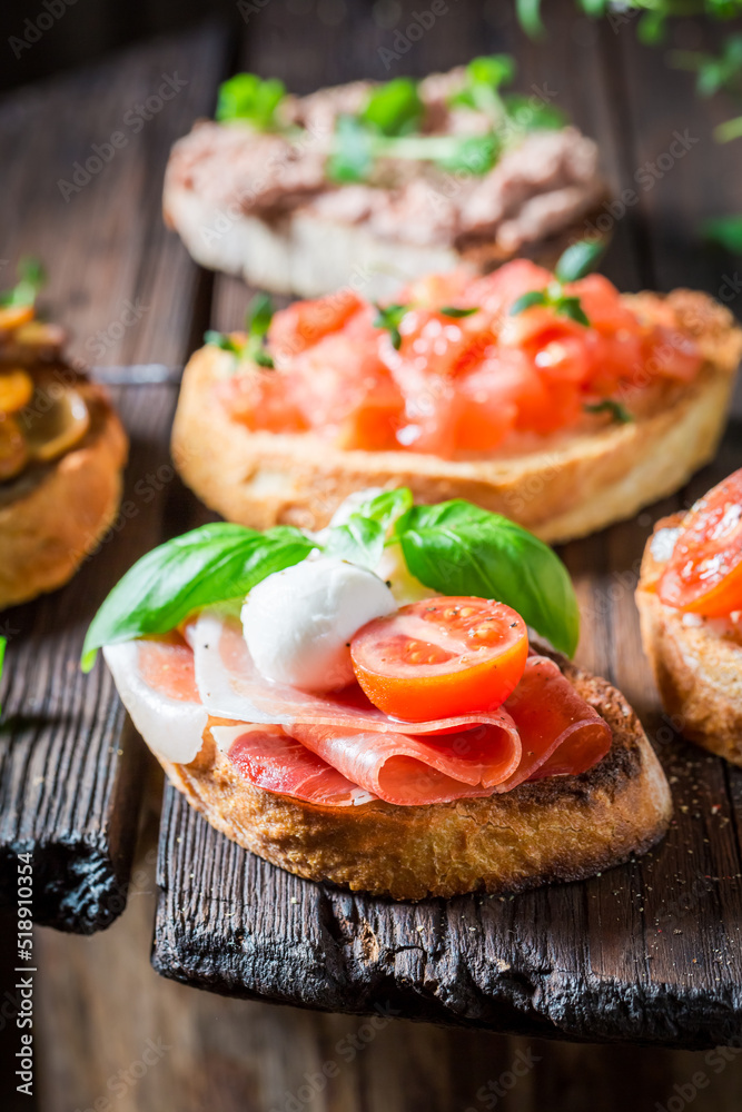 Homemade mix of bruschetta with fresh ingredients for breakfast. Homemade mix of bruschetta with fresh ingredients for breakfast.