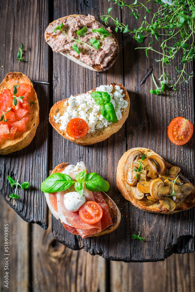 Crisp and hot various bruschetta with fresh ingredients for breakfast. Crisp and hot various bruschetta with fresh ingredients for breakfast.