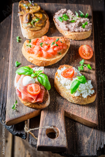 Hot and tasty mix of bruschetta with fresh ingredients.