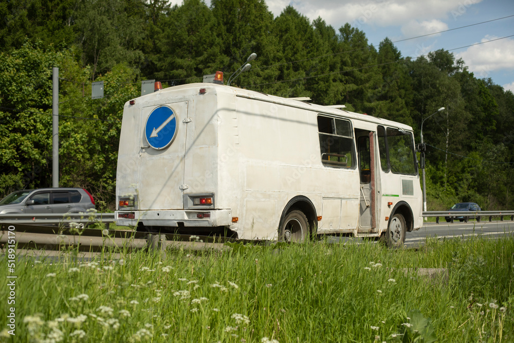 Bus on road with signal lights. Maintenance of road.