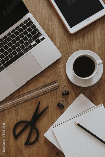 Laptop  notebook  coffee cup on brown wooden table. Flat lay  top view aesthetic home office workspace