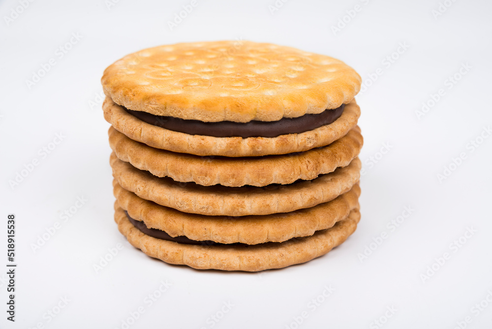 Crispy sandwich biscuits with fluffy cream on a white Crispy sandwich biscuits with fluffy cream on a white