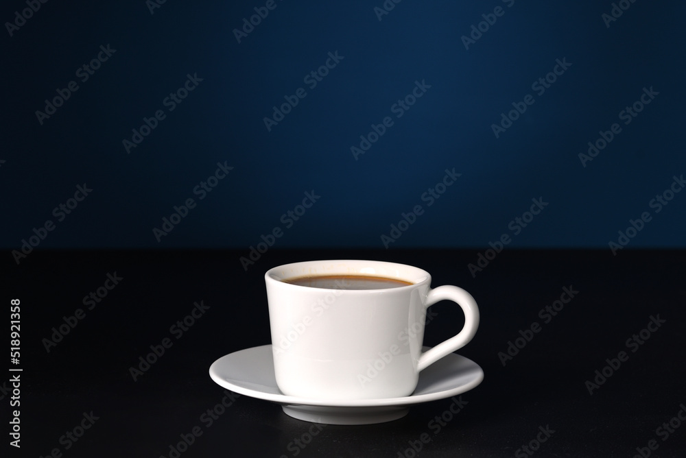 Coffee in white dishes on a dark background. Coffee in white dishes on a dark background.